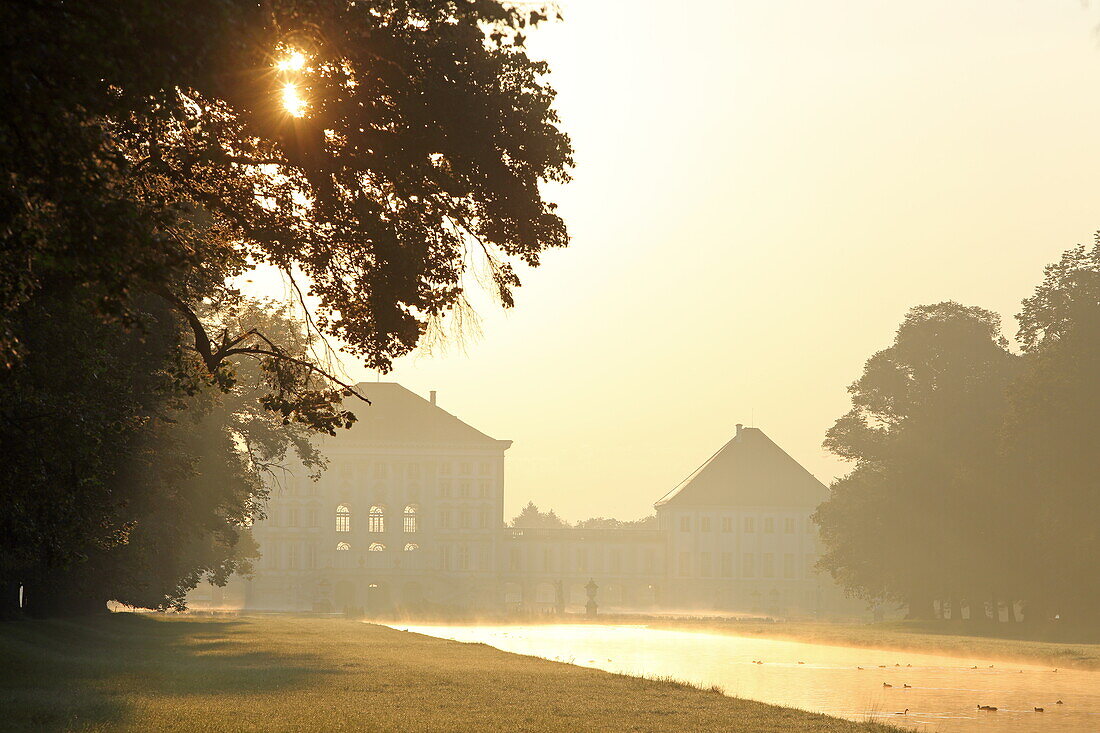 Sunrise in Nymphenburg Park with Nymphenburg Palace, Munich, Upper Bavaria, Bavaria, Germany