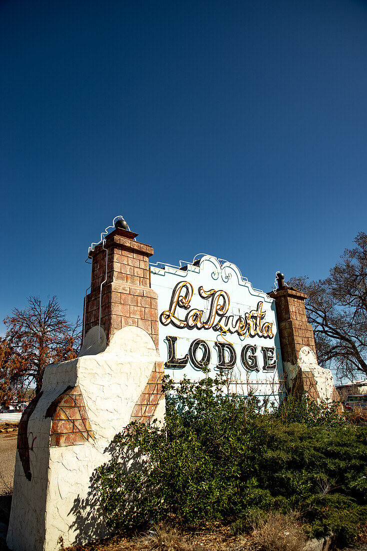 Old La Puerta Lodge neon sign along former Route 66 in Albuquerque, New Mexico