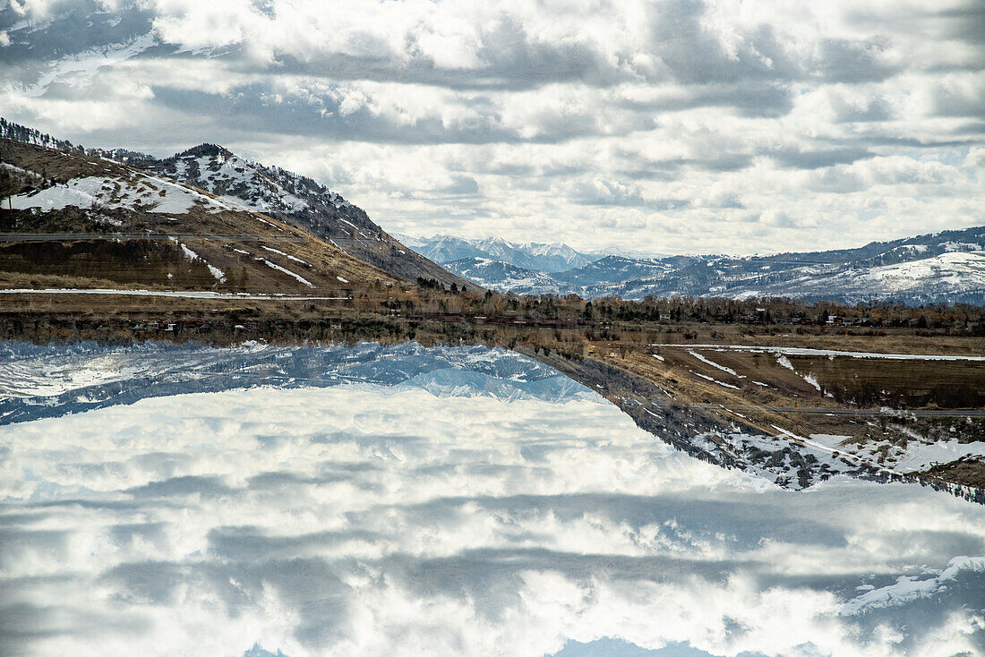 Panoramic double exposure of the Grand Teton mountain range.