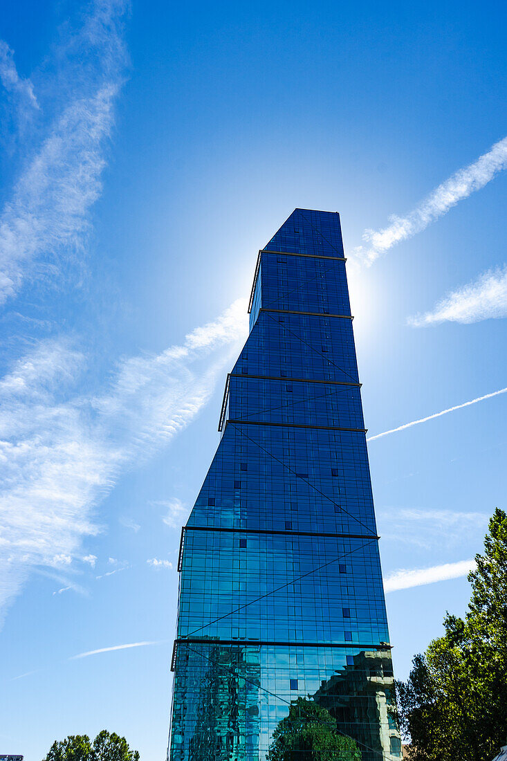 Glass skyscraper in Tbilisi's downtown on the blue sky background