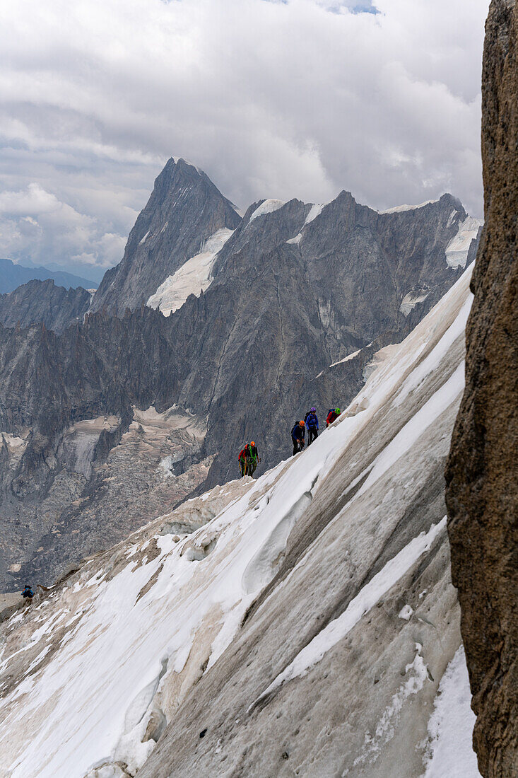 View from the Aiguille du Midi on a rope team in the high mountains, Vallée de Chamonix-Mont-Blanc, Le Mont-Blanc, Bonneville, Haute-Savoie, Auvergne-Rhône-Alpes, France