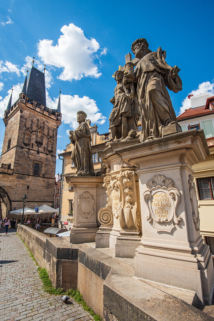 Charles Bridge with the bridge towers in Prague's Lesser Quarter and sculptural group depicting Saints Salvator and Cosmas and Damian, Prague, Czech Republic