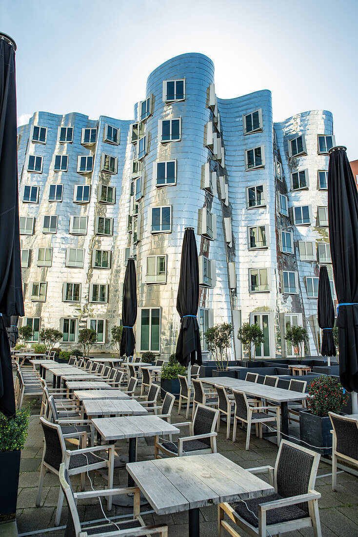 Terraces in front of the Gehry buildings by the Rhine River in Düsseldorf, Germany