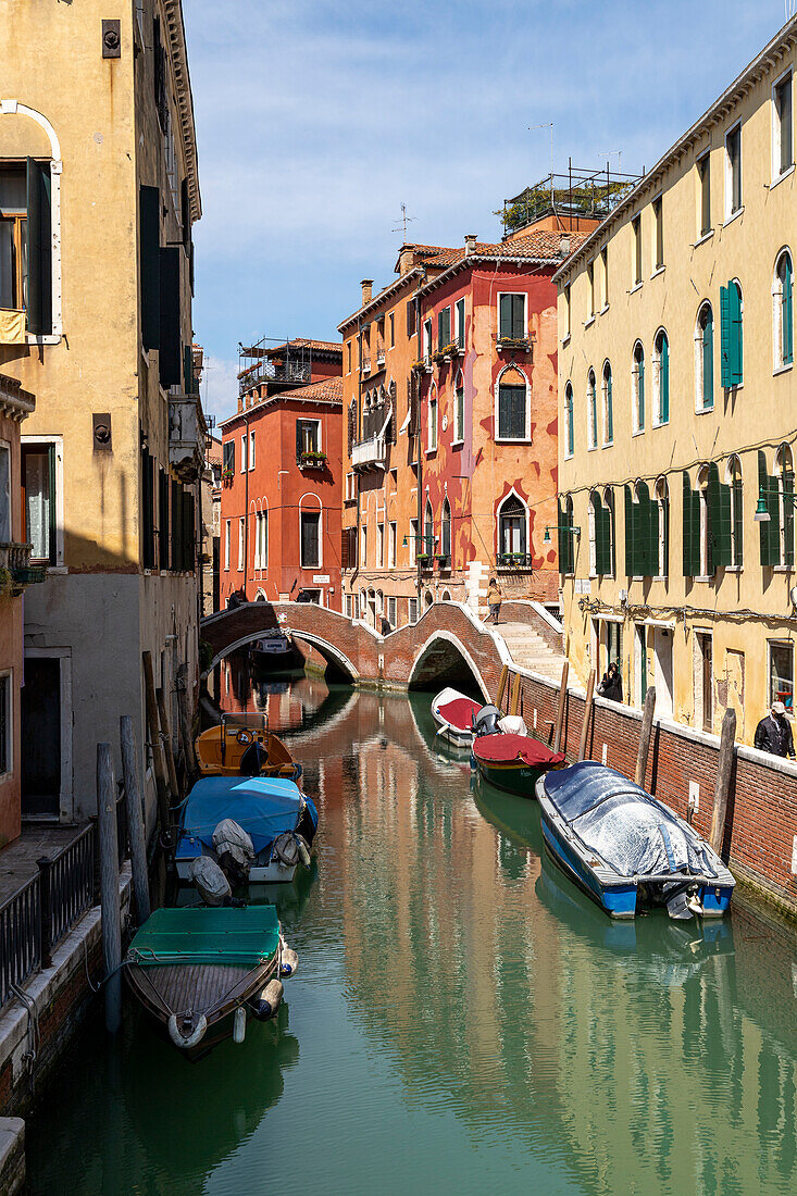 Boats moored in the Rio del Mondo Novo, Venice, Veneto, Italy.