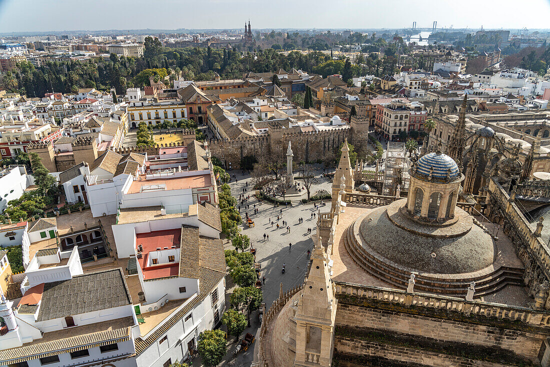 View from the Cathedral on Plaza del Triunfo, Alcázar Royal Palace and the old town of Seville Andalusia, Spain