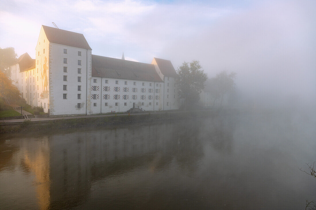 former ducal castle in the morning mist over the Danube in Straubing in Lower Bavaria in Germany