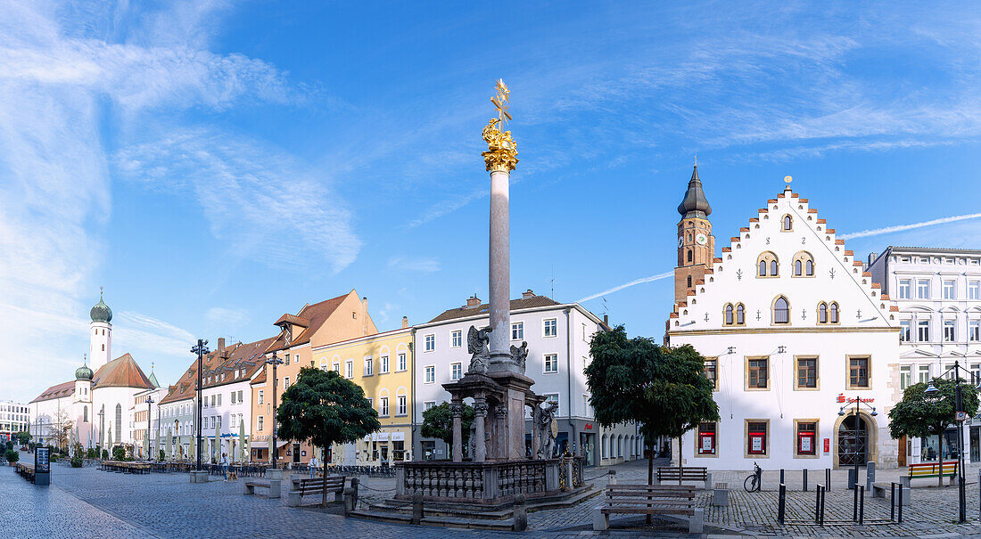 Theresienplatz with Trinity Column, Fountain of St. Tiburtius and view of former Jesuit Church in Straubing in Lower Bavaria in Germany