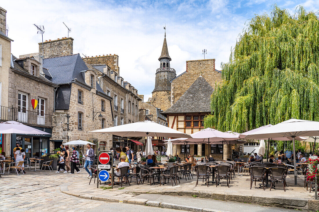 Restaurant and the Tour de l'Horloge clock tower in the historic town of Dinan, Brittany, France