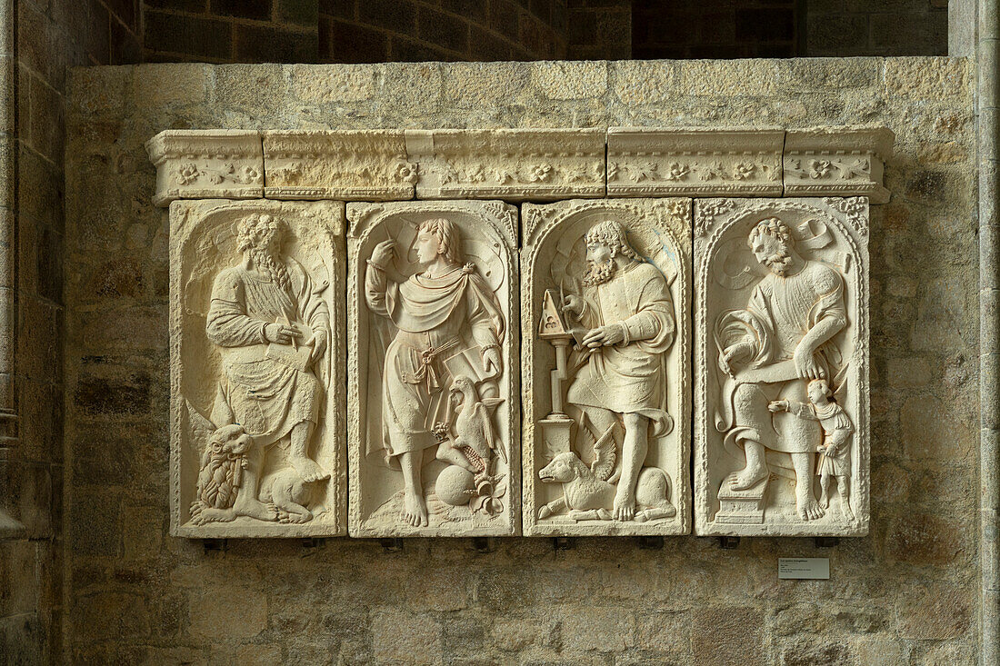 Limestone relief of the four evangelists Mark, John, Luke and Matthew, Mont Saint-Michel monastery hill, Le Mont-Saint-Michel, Normandy, France