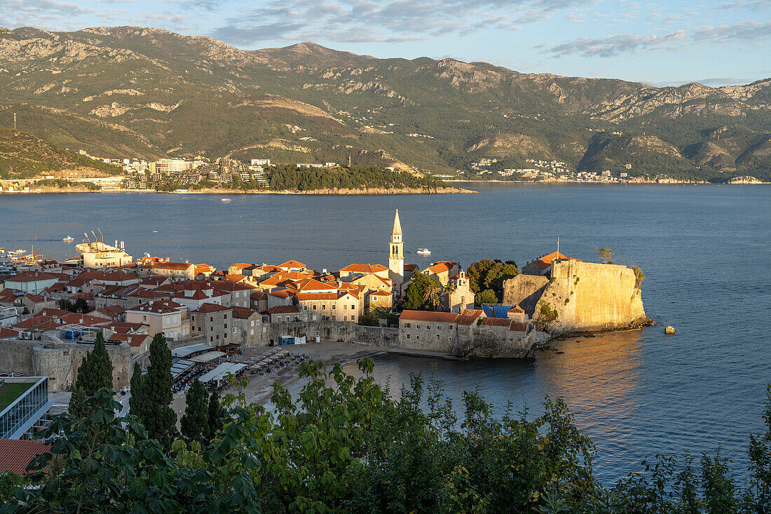 View of Plaža Ricardova Glava beach and Budva old town, Montenegro, Europe