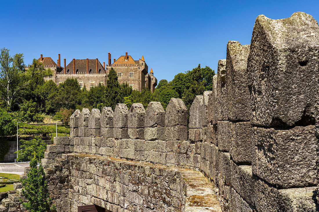 Adarve da Muralha, the city walls and the Paço Ducal Palace, Guimaraes, Portugal, Europe