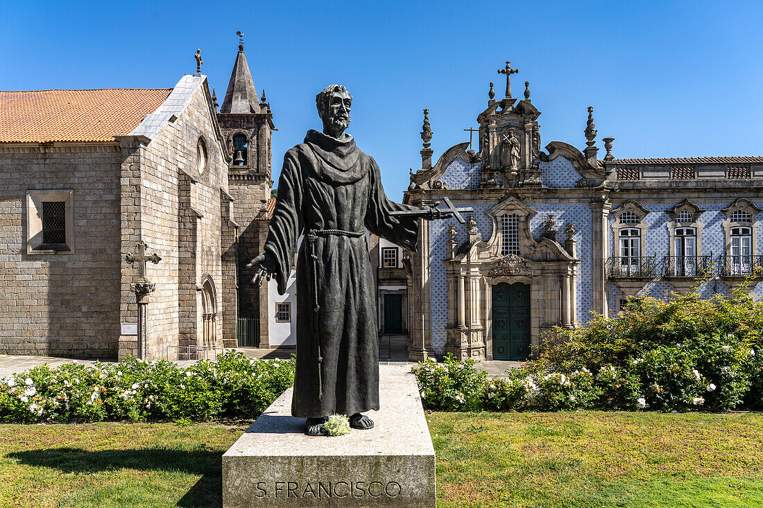 Statue of Saint Francis in front of the Igreja de Sao Francisco church, Guimaraes, Portugal, Europe