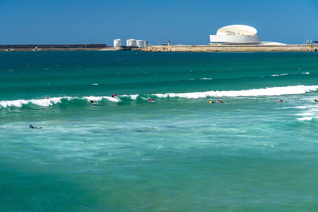 Surfers in the sea at Matosinhos Beach near Porto, Portugal, Europe