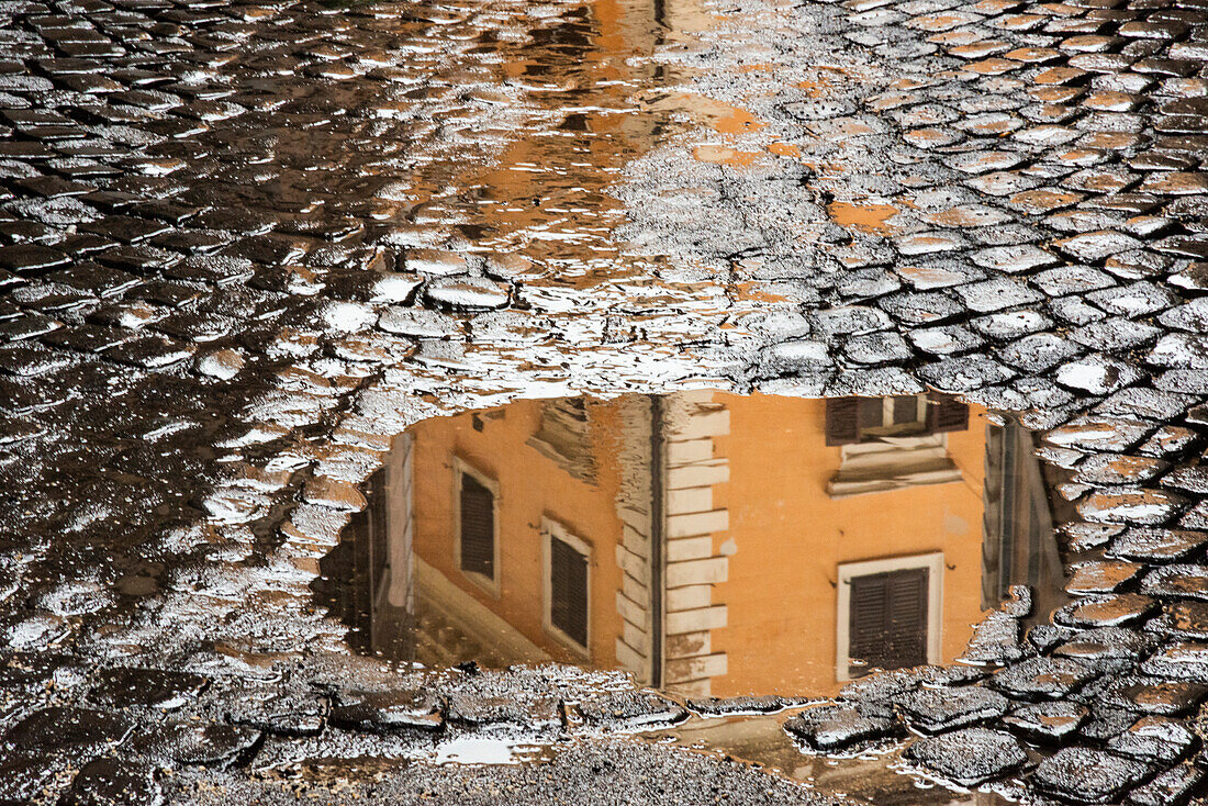 Italy, Rome. Via di Ripetta, puddles after the rain.