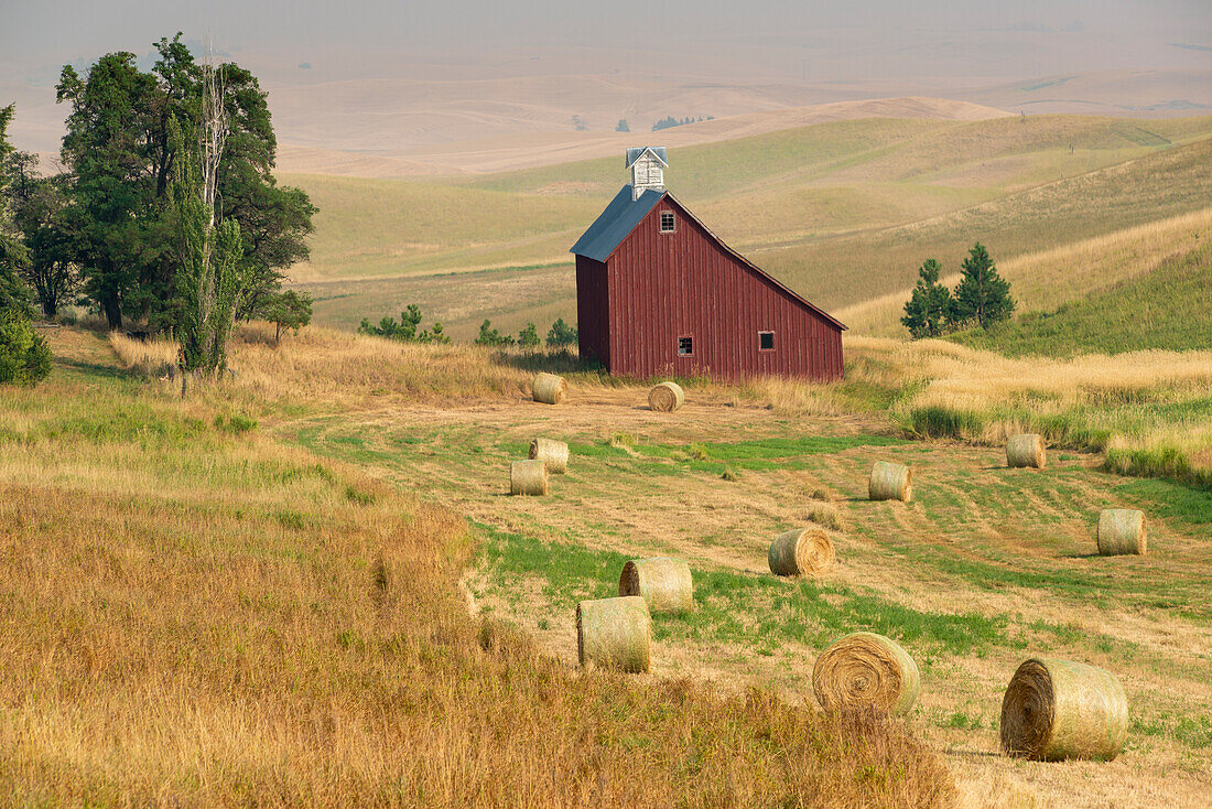 Red barn and wheat bales near Moscow, Idaho