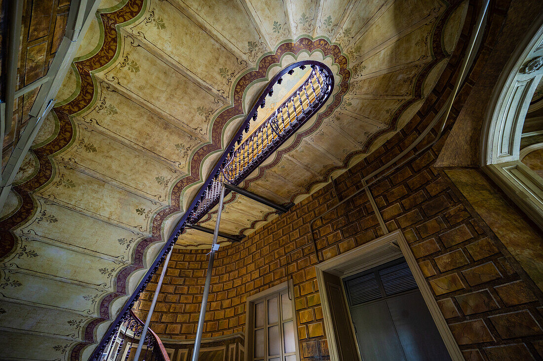 Interior of entrance hall with carved staircase in old maisons in Tbilisi's downtown, capital city of Georgia