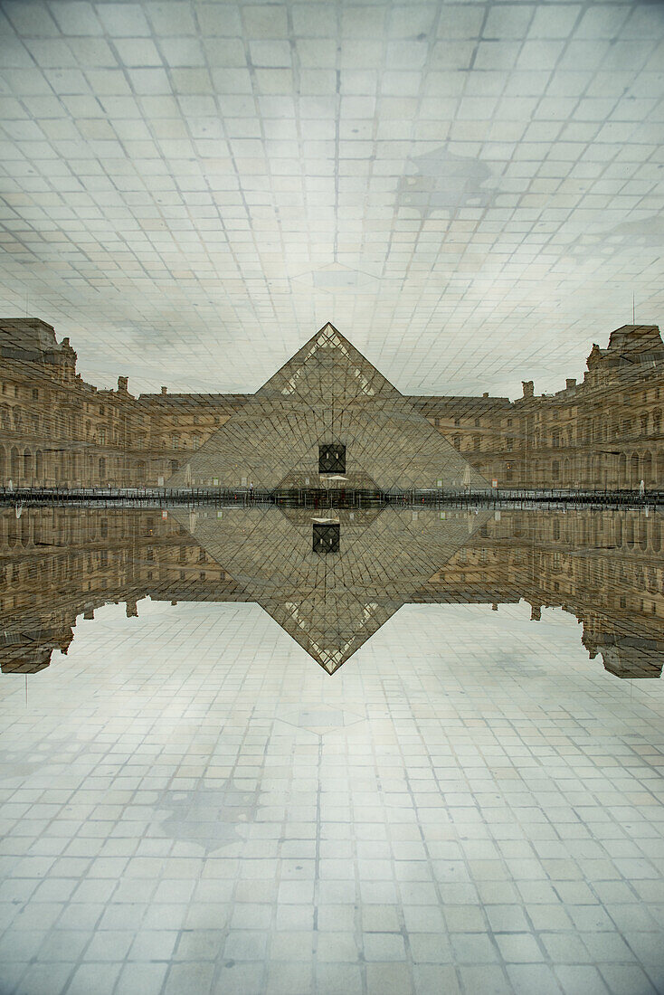 Double exposure of the glass pyramid entrance of the famed Louvre museum in Paris, France
