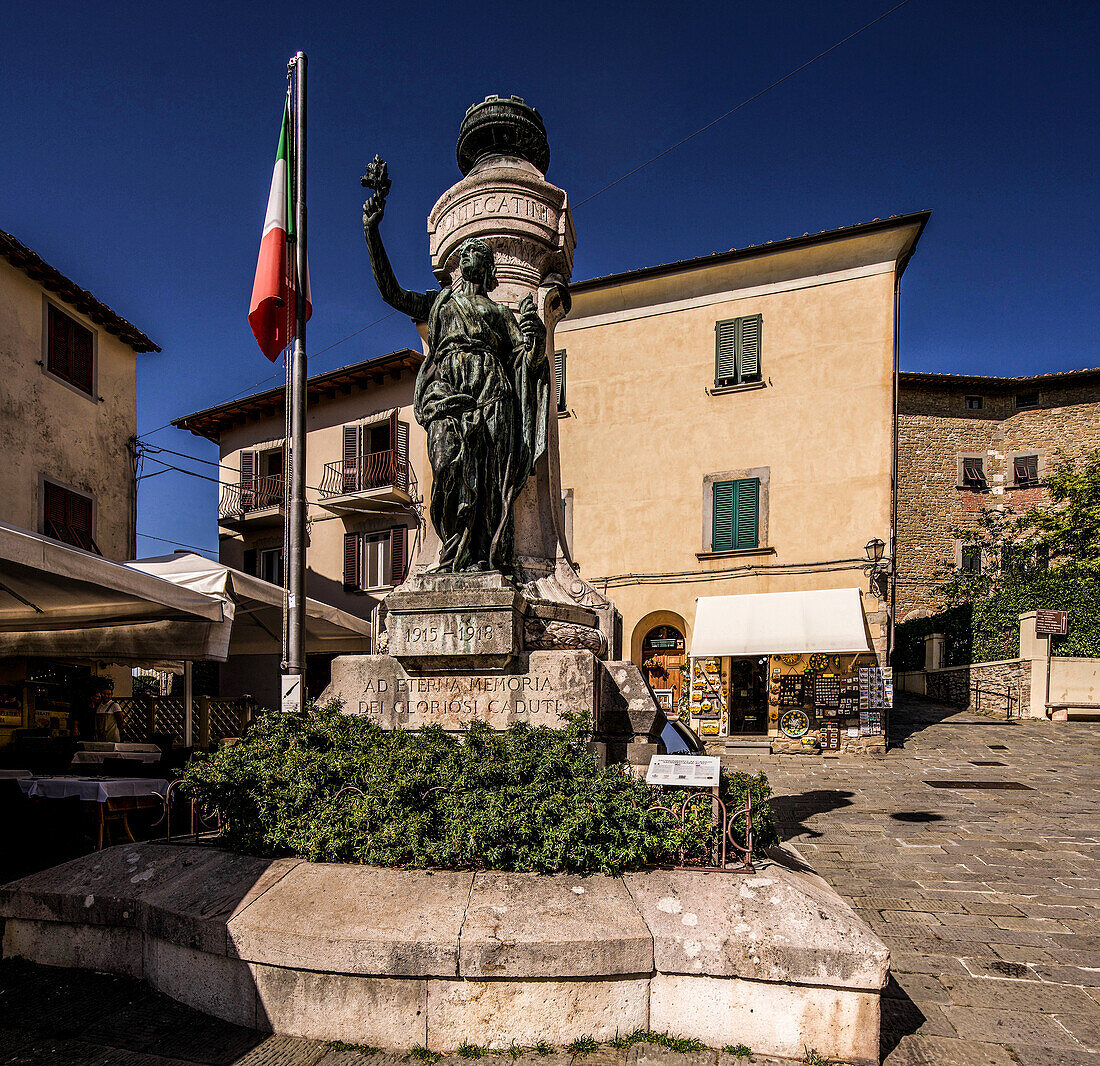 War memorial, street restaurant and souvenir shop in Piazza G. Giusti, Montecatini Alto, Tuscany, Italy