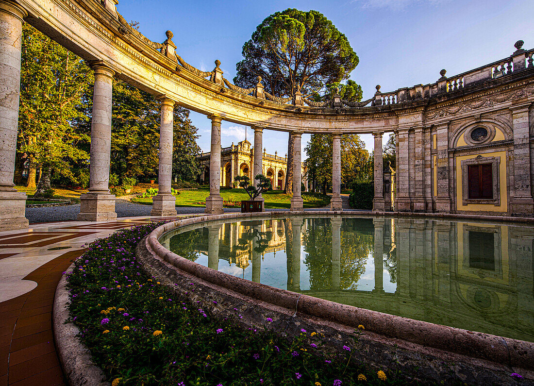 Terme Tettuccio: fountain with semicircular colonnade, view towards Terme Regina in Tettuccio Park, Montecatini Terme, Tuscany, Italy