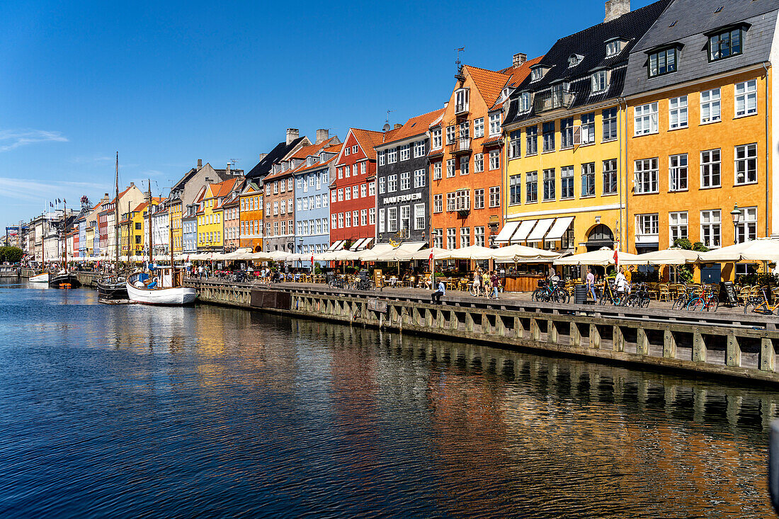 Colorful houses, restaurants and historic ships at Nyhavn Canal and Harbour, Copenhagen, Denmark, Europe