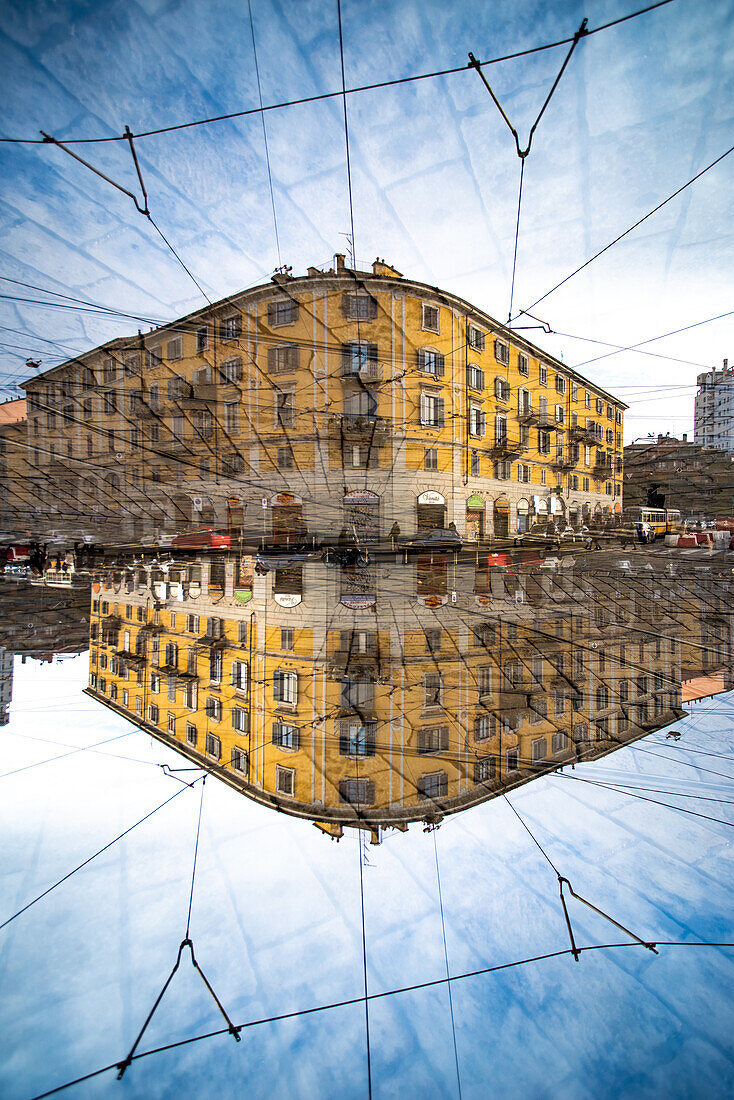 A corner building in the Porta Genova district in Milan, Italy.