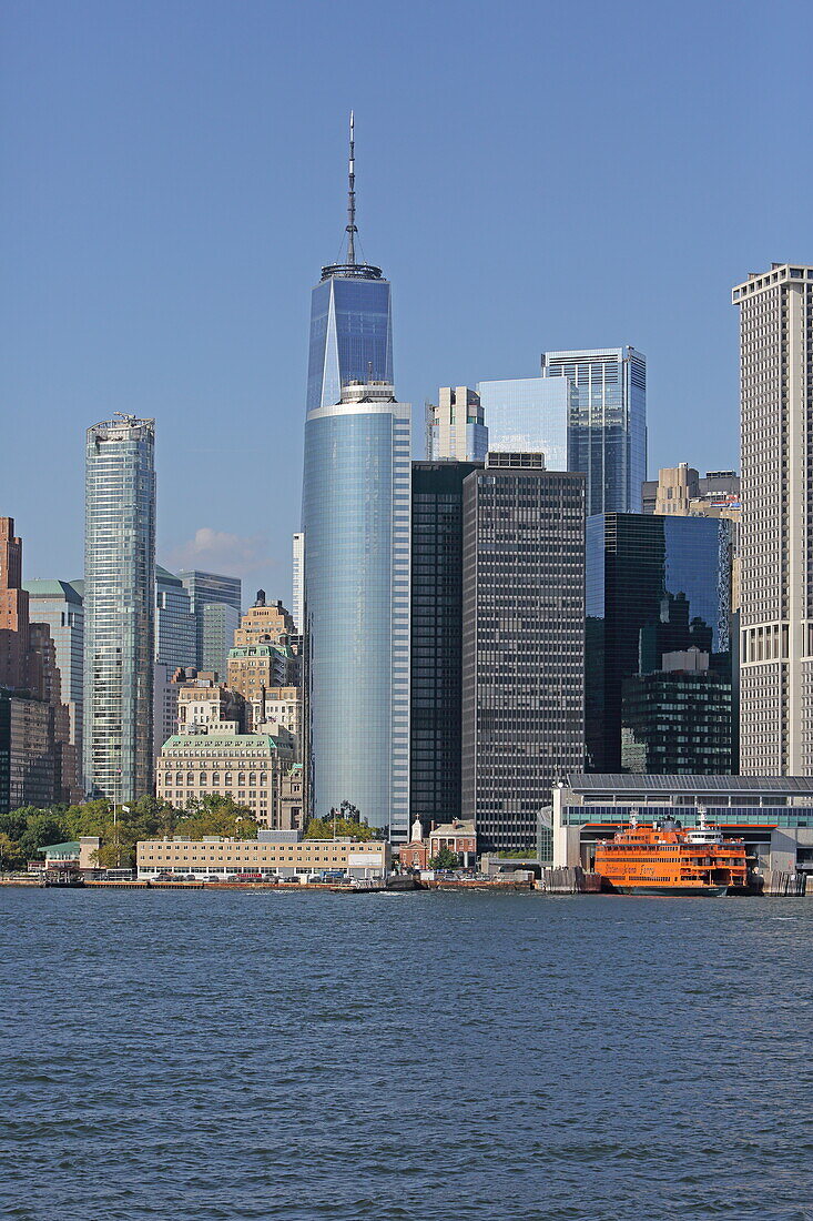 View of the Staten Island Ferry terminal (right), the 17 State Street office building and behind it the One World Trace Center, Manhattan, New York, New York, USA