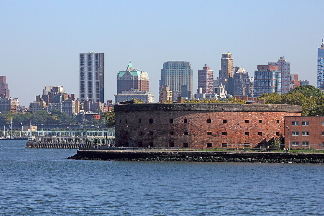 View of Castle William on Govenor Island, with the Brooklyn skyline in the background, New York, New York, USA