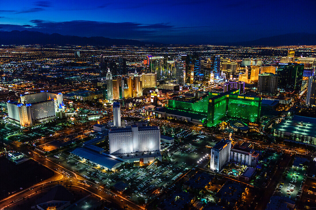 Aerial view of the city of Las Vegas at dusk, city lights and tall buildings of the travel destination.