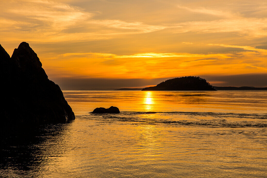 Sunset from North Beach with Deception Island at Deception Pass State Park, Washington State, USA