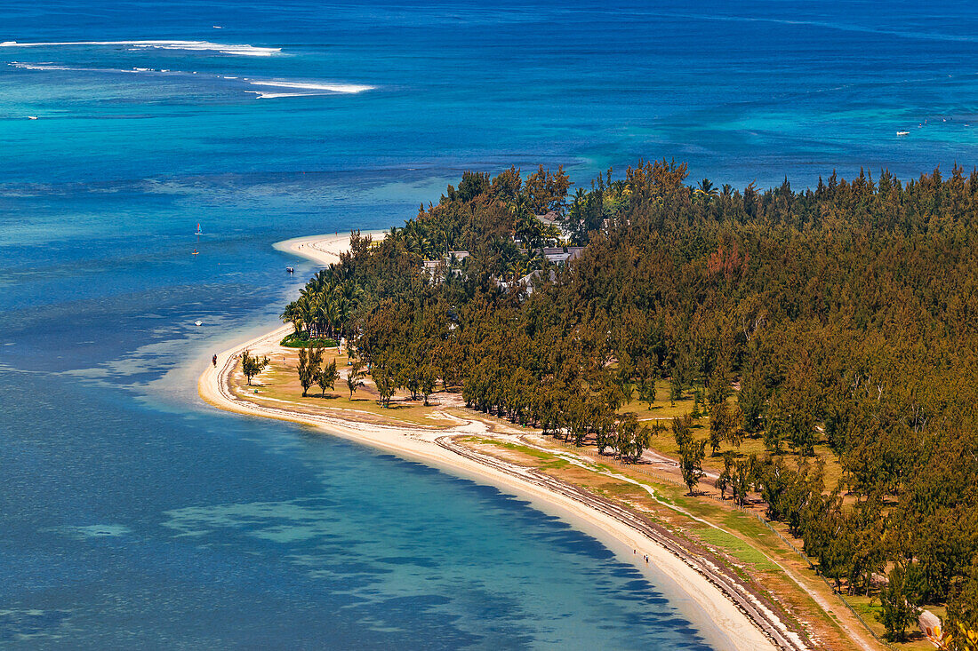 The southern tip of Le Morne beach with sea and trees on the island of Mauritius in the Indian Ocean