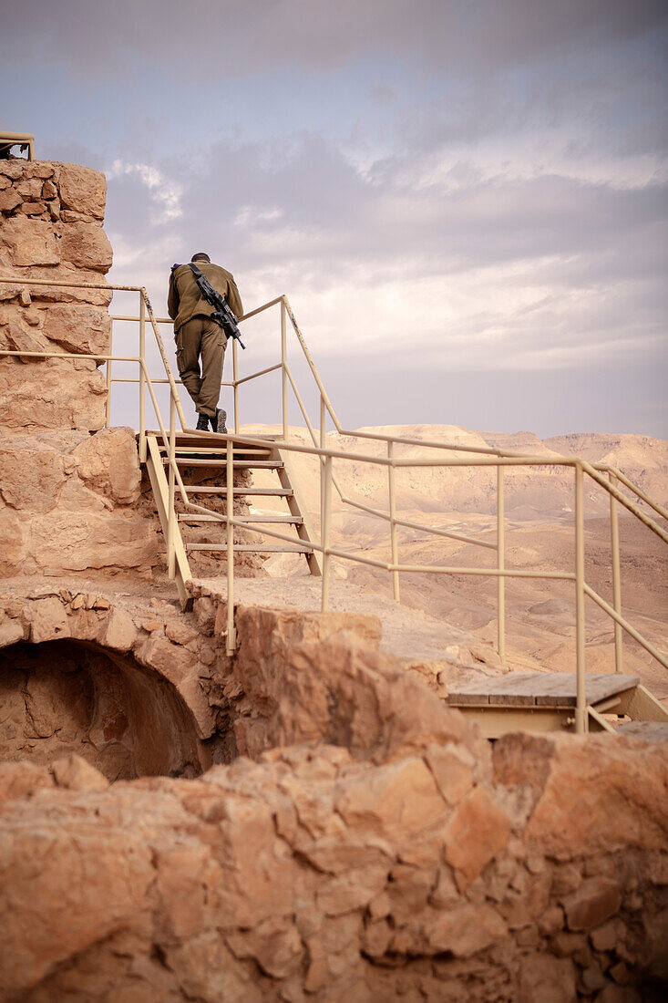 Israeli soldier with machine gun keeps guard, Masada, Dead Sea, Israel, Middle East, Asia, UNESCO World Heritage Site