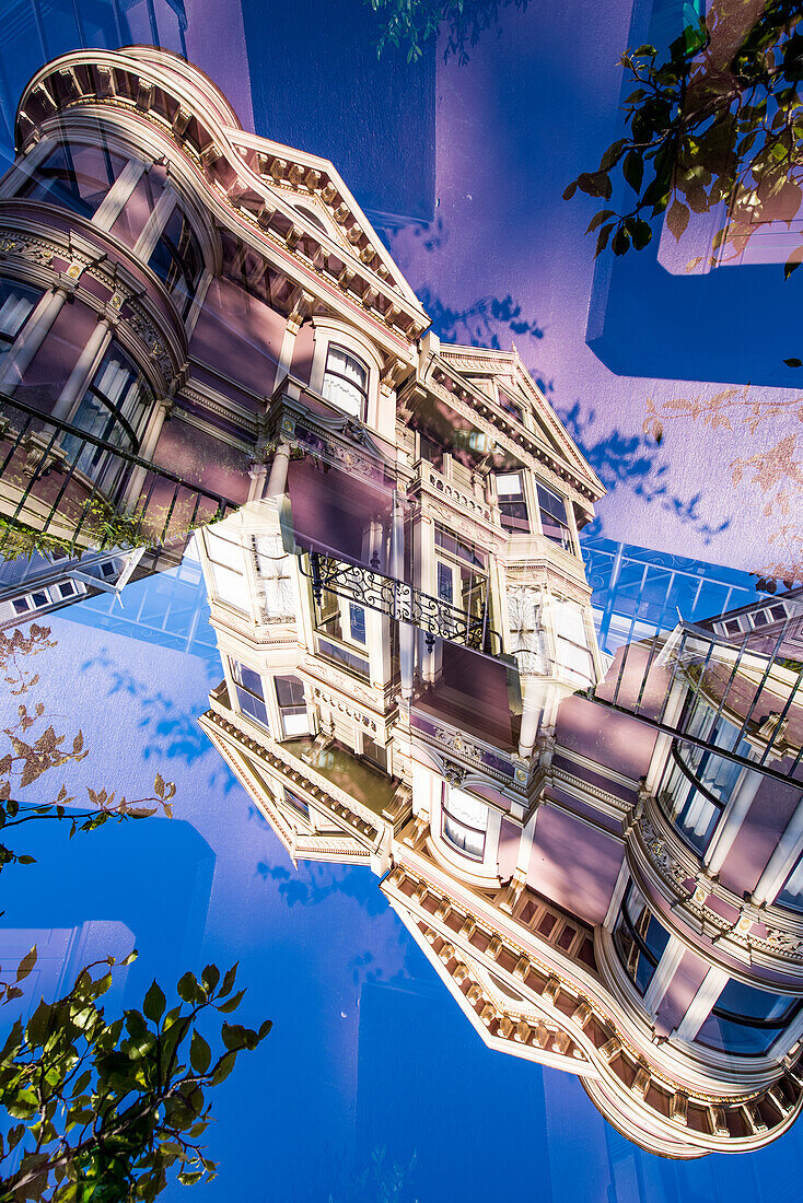 Double exposure of a Victorian style colorful wooden residential building on Steiner street in San Francisco, California. These houses are known as the Painted Ladies.