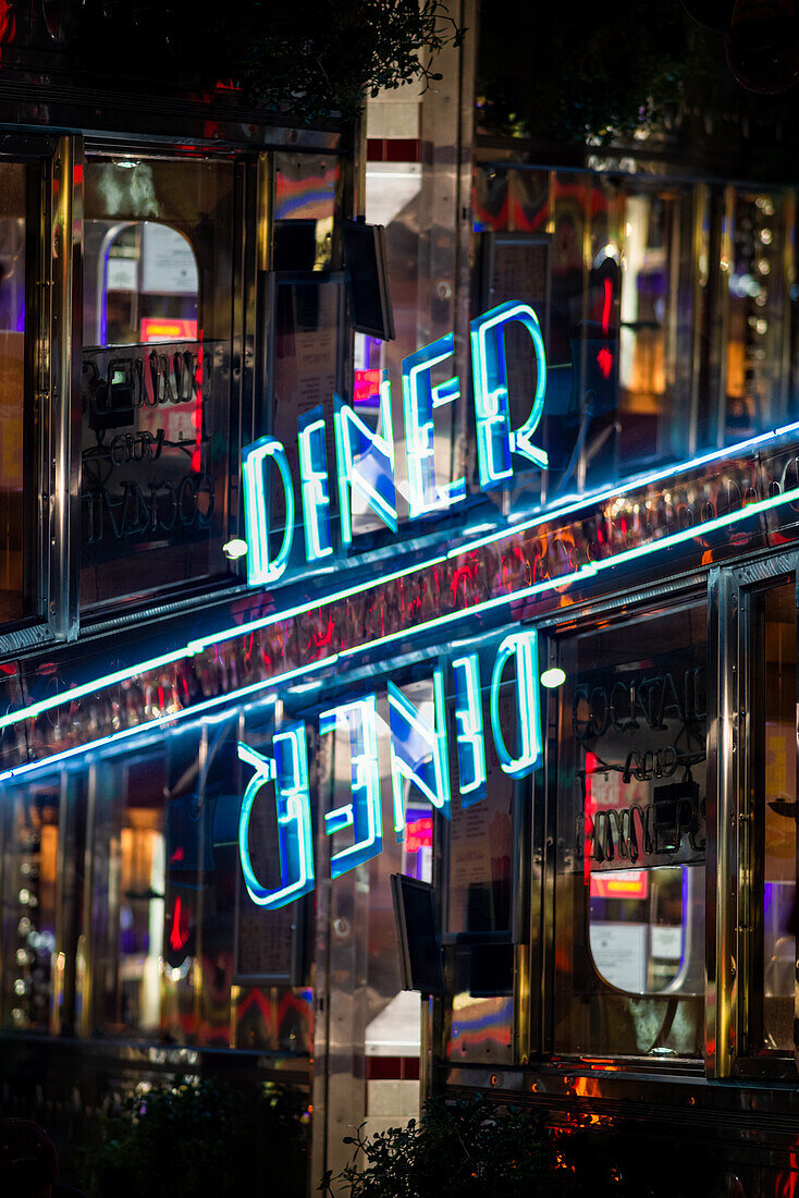 Double exposure of a neon diner sign in Miami, Florida