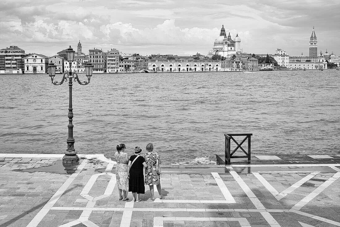 Women looking at San Marco, Giudecca, Venice, Veneto, Italy, Europe
