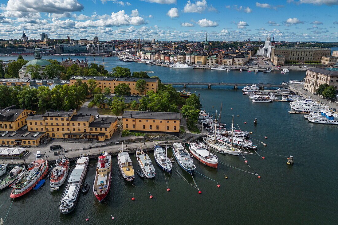 Aerial view of boats moored along Skeppsholmen island with the city behind, Stockholm, Stockholm, Sweden, Europe