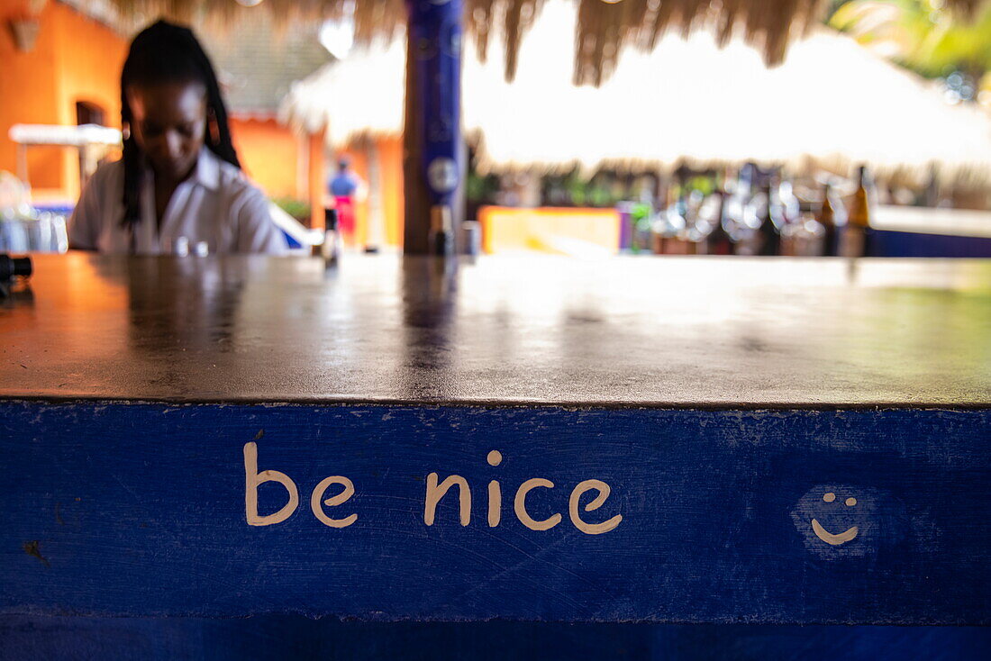 &#39;Be nice'39; lettering on bar counter at Laluna Resort, Morne Rouge, Saint George, Grenada, Caribbean