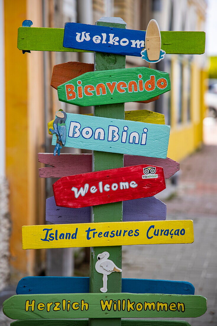 Colorful welcome signs in different languages in front of souvenir shop in Punda, Willemstad, Curaçao, Netherlands Antilles, Caribbean