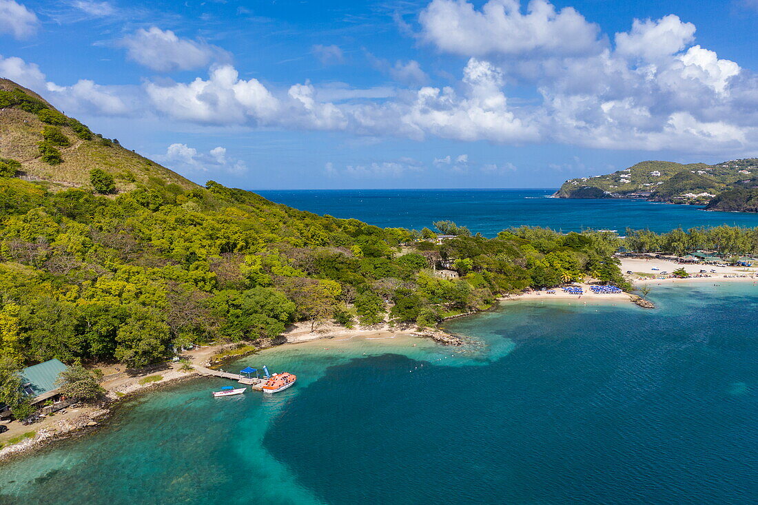 Aerial view of tender boats from expedition cruise ship World Voyager (nicko cruises) at pier of Pigeon Island National Landmark, Gros Islet Quarter, St. Lucia, Caribbean