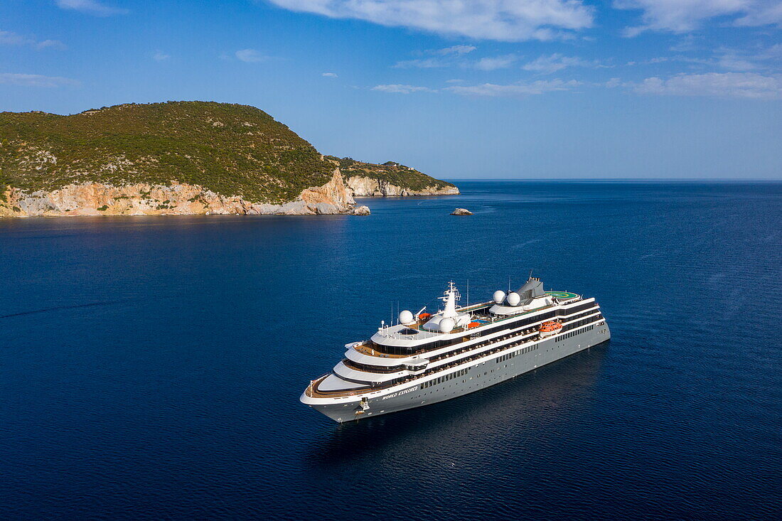 Aerial view of expedition cruise ship World Explorer (nicko cruises) with coastline behind, Skopelos, Thessaly, Greece, Europe