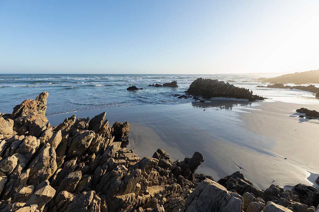 South Africa, Hermanus, Voelklip Beach with rocks and sand