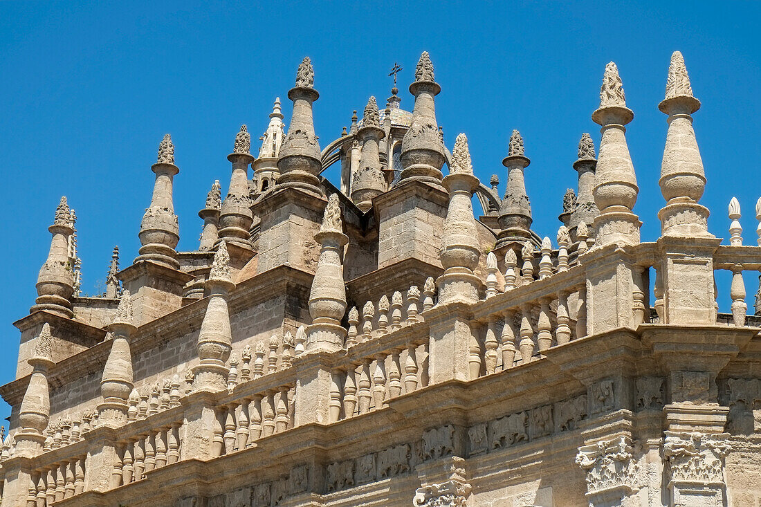 Spain, Seville, Sky above decorative stone details on cathedral building