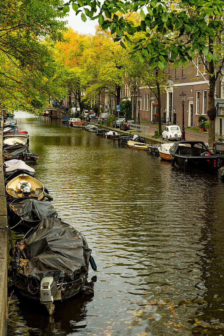 A variety of boats on the canals of Amsterdam.