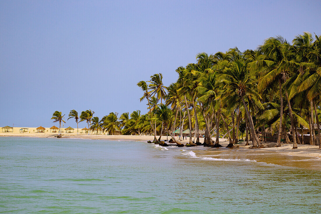 Ada Foah Beach and fishing village of Ada Foah and palm trees on the banks of the Volta River in the Greater Accra region of eastern Ghana in West Africa