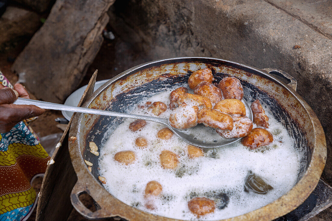 fried corn dumplings at the market in Sawla in the Savannah Region of central Ghana in West Africa