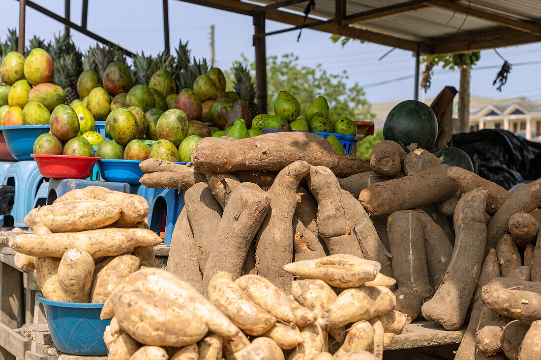 Street sale of mangoes and yams in Winneba in the Central Region of western Ghana in West Africa