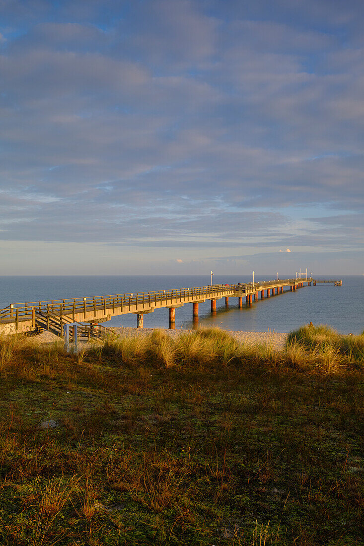 Sunrise at the pier on the north beach in the Baltic Sea resort of Prerow on the Darss, Fischland-Darss-Zingst, Mecklenburg Western Pomerania, Germany
