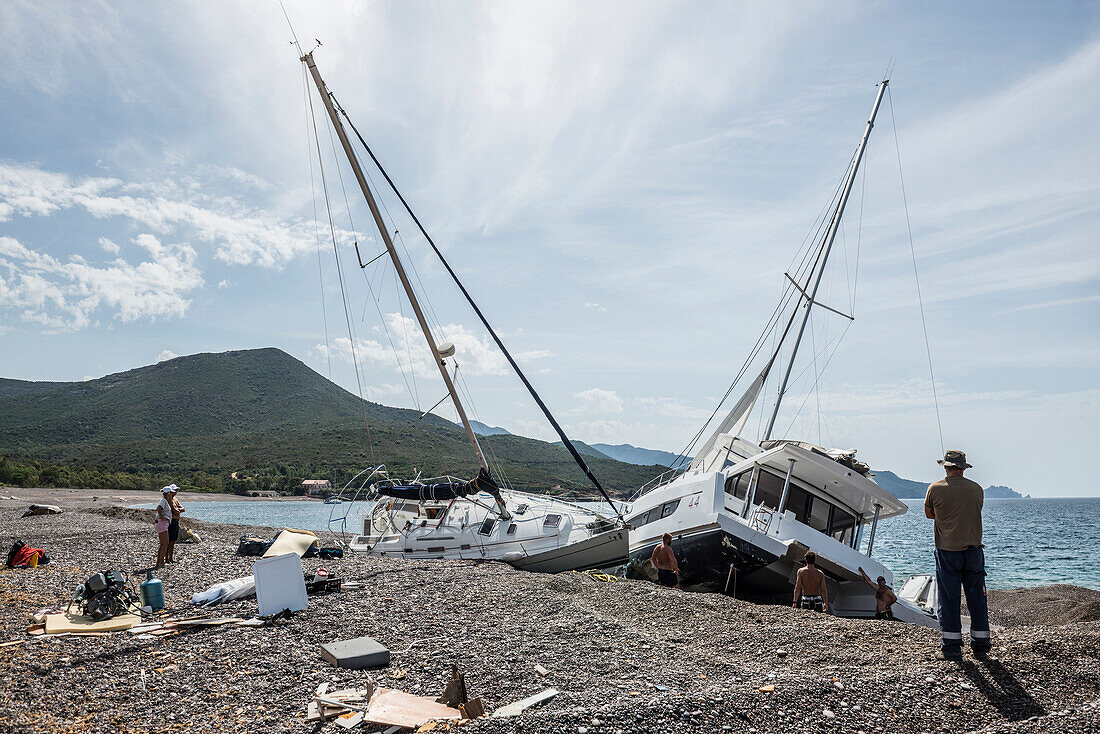 Luxury yachts stranded after a storm, Playa de Argentella, Calenzana, Haute-Corse department, west coast, Corsica, Mediterranean Sea, France