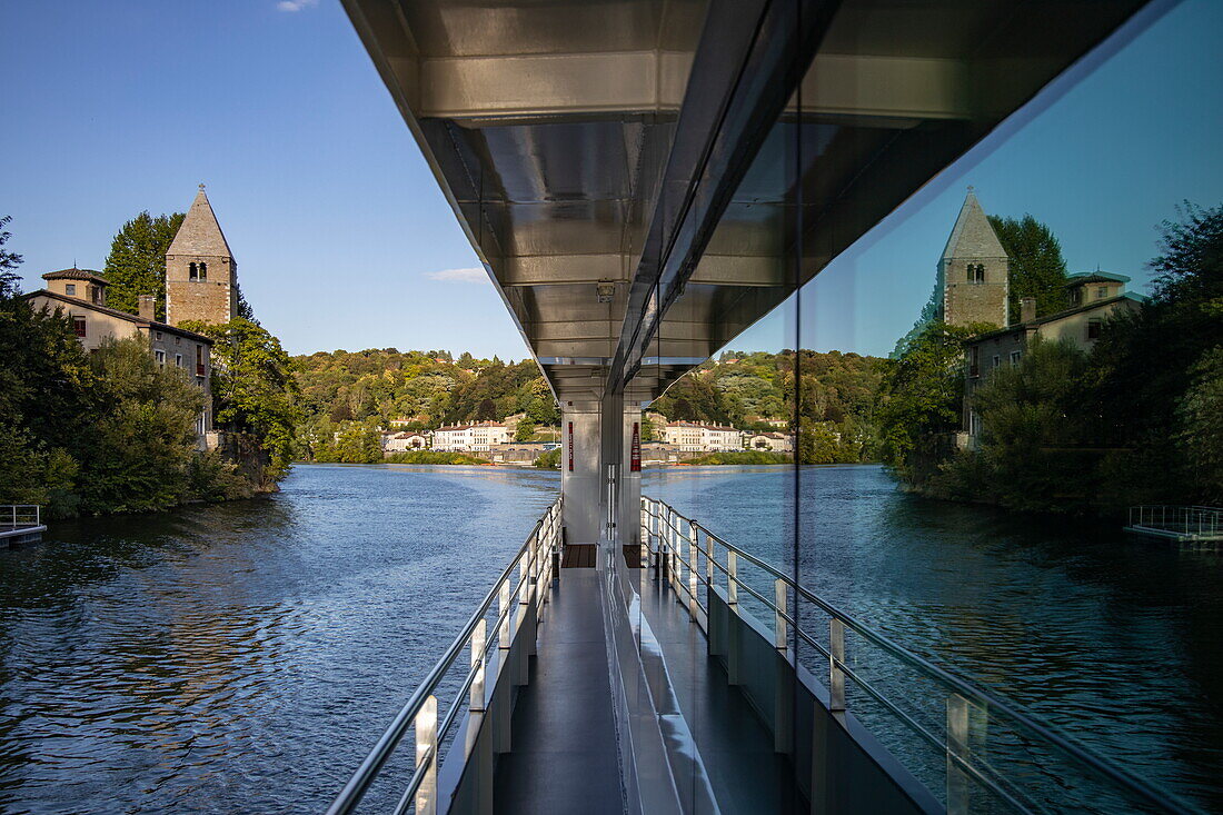 Reflection in the window of the Excellence Rhône river cruise ship (travel agency Mittelthurgau) approaching Lyon on the Saône, near Lyon, Lyon, Rhône, France, Europe