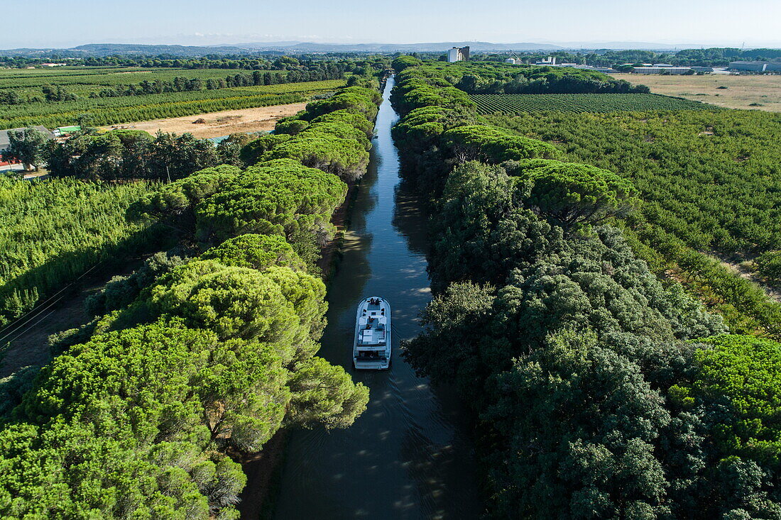 Aerial view of a Le Boat Horizon 5 houseboat on the Canal du Midi, Sallèles-d'Aude, Aude, France, Europe