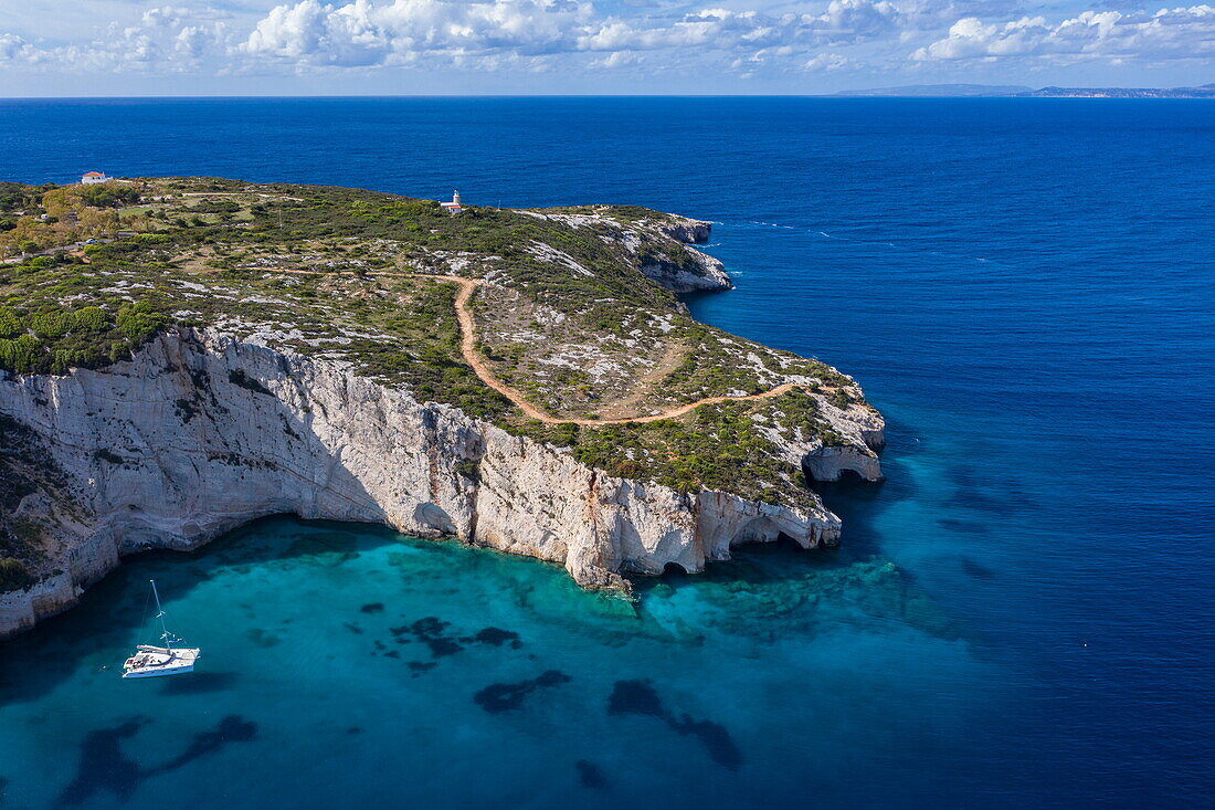 Aerial view of a catamaran in secluded bay with cliffs behind, Volimes, Zakynthos, Ionian Islands, Greece, Europe